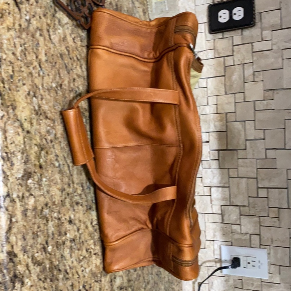 Piel gently used leather duffel bag